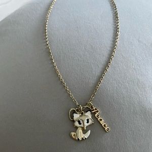gold necklace with 3 charms
